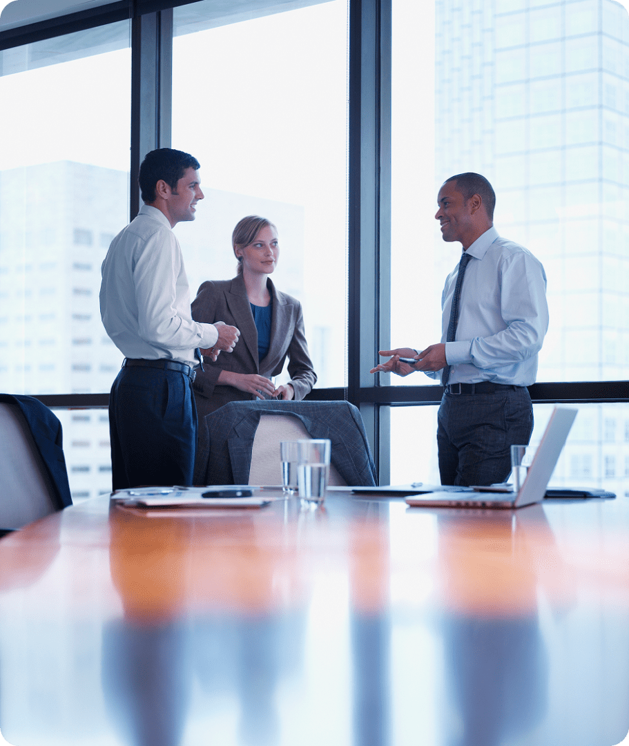 Professionals discussing work in conference room