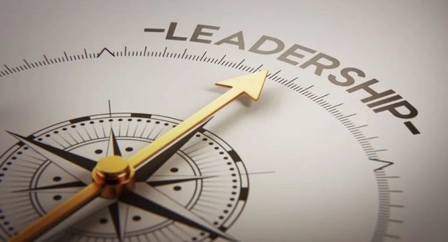 A compass pointing towards the word 'LEADERSHIP'.